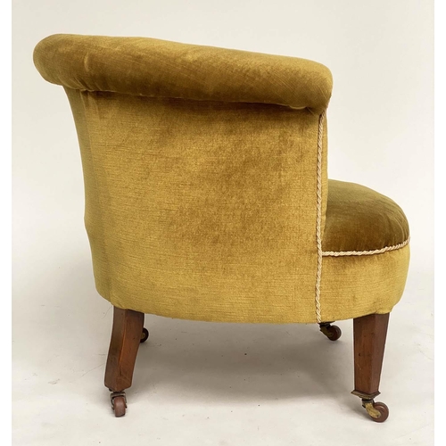 194 - ARMCHAIR, Edwardian mahogany with deep buttoned bow back, golden yellow velvet upholstered and taper... 