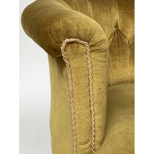 194 - ARMCHAIR, Edwardian mahogany with deep buttoned bow back, golden yellow velvet upholstered and taper... 