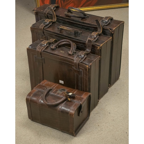 343 - ARIES LUGGAGE, a set of three, Spanish brown leather suitcases and a small holdall, largest 45cm x 6... 