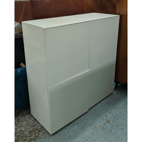 448 - NATUZZI CABINET, 124cm x 48cm x 128cm H, white lacquered finish.