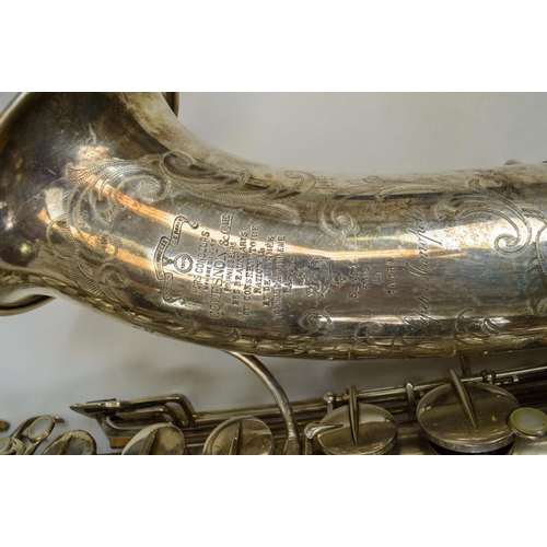 8 - COUESNON MONOPLOE SAXOPHONE SILVER PLATED, with inscription and case.