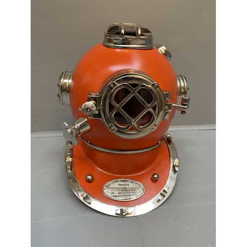 432 - DISPLAY DIVING HELMET, decorative reproduction US Navy design, lacquered orange finish, 46cm x 46cm ... 