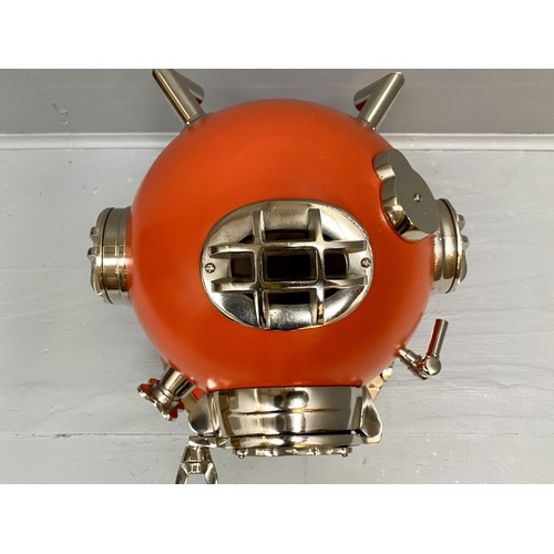 432 - DISPLAY DIVING HELMET, decorative reproduction US Navy design, lacquered orange finish, 46cm x 46cm ... 