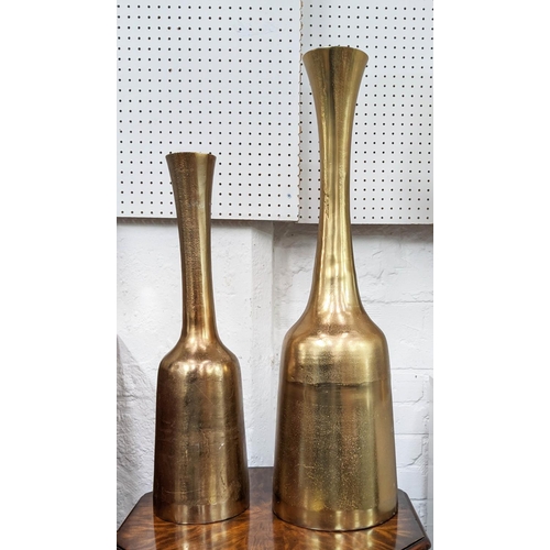 450 - BOTTLE VASES, a graduated pair, gilt metal, 69cm H. (2)