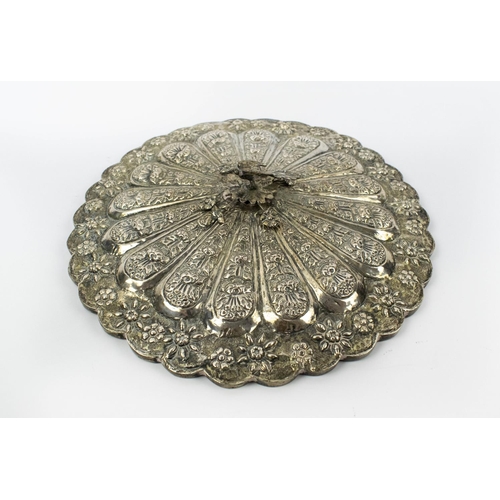2 - OTTOMAN SILVER REPOUSSE MIRROR, with foliate decoration and mounted bird, 28cm diam.