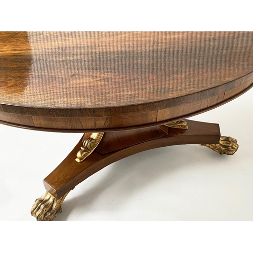 297 - BREAKFAST TABLE, Regency rosewood circular with gilded paw supports, 122cm x 73cm H.