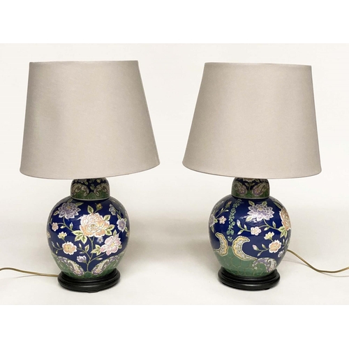 140 - TABLE LAMPS, a pair, Chinese lidded ginger jar form, ceramic with blossom, blue and emerald green gr... 