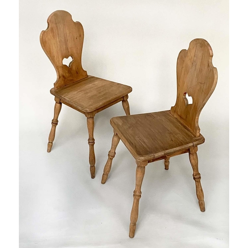 144 - SWISS HALL CHAIRS, a pair, early 20th century pine, each with shaped pierced back and cleated seat, ... 