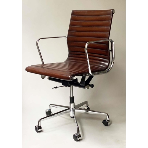 149 - REVOLVING DESK CHAIR, Charles and ray Eames inspired ribbed tan leather revolving and reclining on a... 