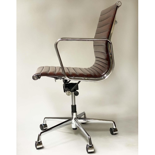 149 - REVOLVING DESK CHAIR, Charles and ray Eames inspired ribbed tan leather revolving and reclining on a... 