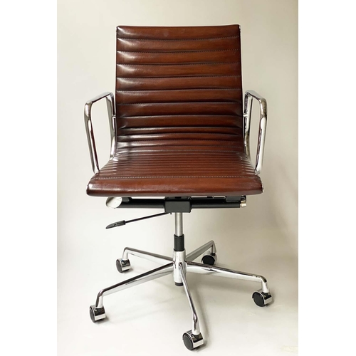 149 - REVOLVING DESK CHAIR, Charles and ray Eames inspired ribbed tan leather revolving and reclining on a... 