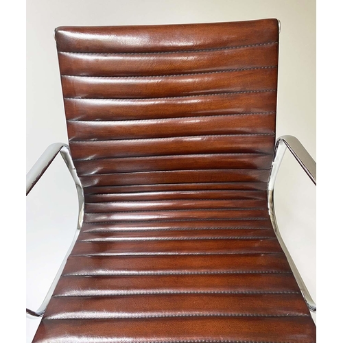 149 - REVOLVING DESK CHAIR, Charles and ray Eames inspired ribbed tan leather revolving and reclining on a... 