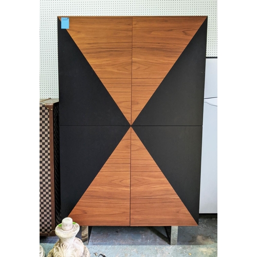 431 - CABINET, teak and ebonised book matched veneers, four doors enclosing adjustable shelves, chrome fee... 