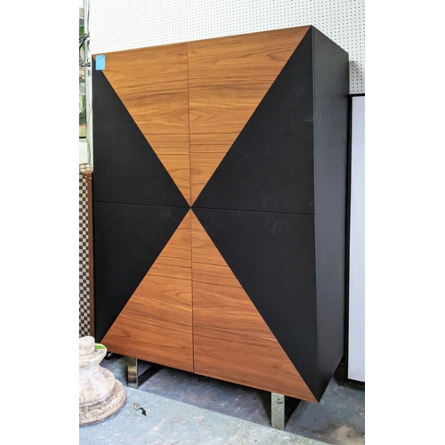 431 - CABINET, teak and ebonised book matched veneers, four doors enclosing adjustable shelves, chrome fee... 