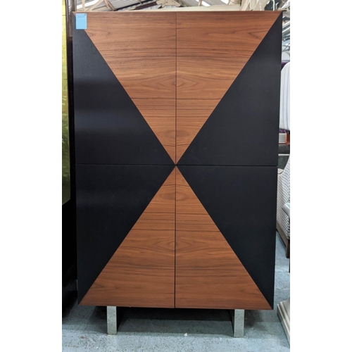 432 - CABINET, teak and ebonised book matched veneers, four doors enclosing adjustable shelves chrome feet... 