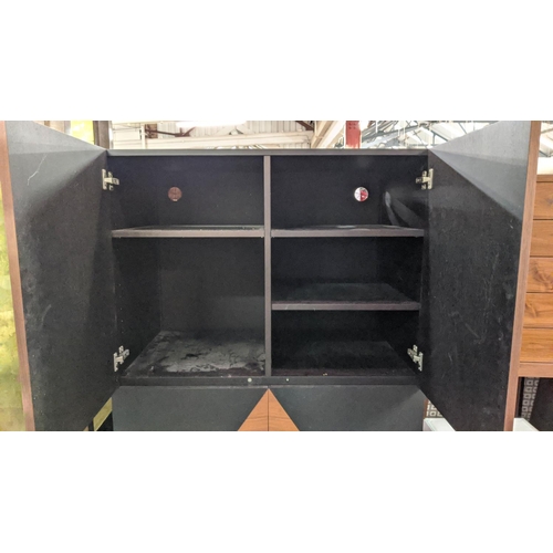 432 - CABINET, teak and ebonised book matched veneers, four doors enclosing adjustable shelves chrome feet... 