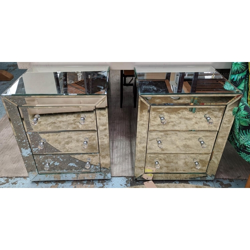 437 - SIDE CHESTS, a pair, mirrored with three drawers, 67cm h x 57cm x 46cm. (2)