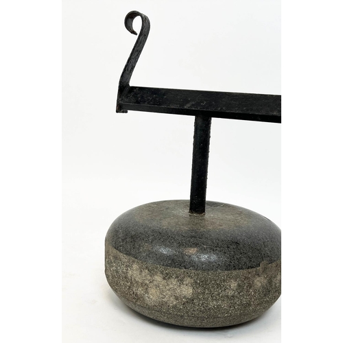 94 - BOOT SCRAPER, made from an antique Scottish granite curling stone, 40cm H x 31cm.