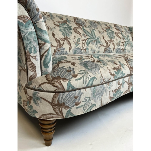 95 - CHESTERFIELD SOFA, country house style, concave front with botanical print upholstery and turned fro... 