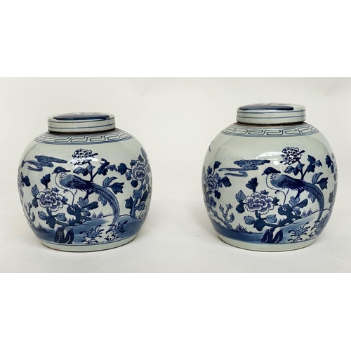 132 - CHINESE GINGER JARS, a pair, Chinese export blue and white ceramic each with lid, 23cm H. (2)