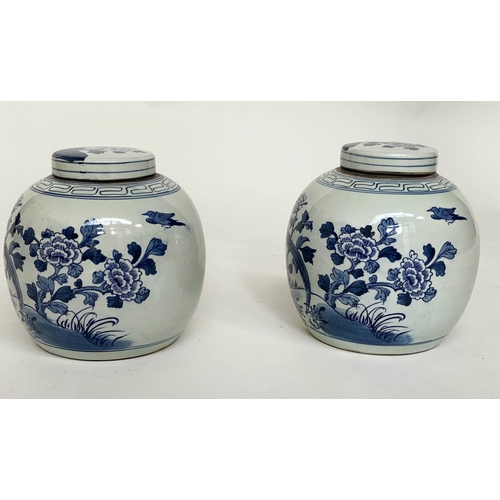 132 - CHINESE GINGER JARS, a pair, Chinese export blue and white ceramic each with lid, 23cm H. (2)