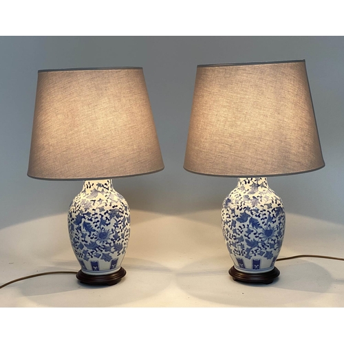 136 - TABLE LAMPS, 75cm H, a pair, Chinese blue and white ceramic of vase form with circular wood bases an... 