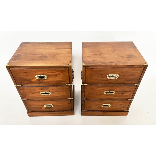 157 - CAMPAIGN STYLE BEDSIDE CHESTS, a pair, yewwood and brass bound each with three drawers, 46cm x 37cm ... 