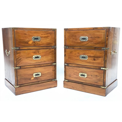 157 - CAMPAIGN STYLE BEDSIDE CHESTS, a pair, yewwood and brass bound each with three drawers, 46cm x 37cm ... 