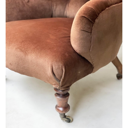 91 - ARMCHAIR, Victorian walnut with brown velvet buttoned upholstery, turned front feet and stamped cast... 