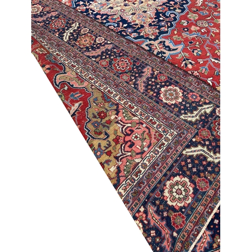 89 - ANTIQUE PERSIAN HERIZ CARPET, 375cm x 290cm.