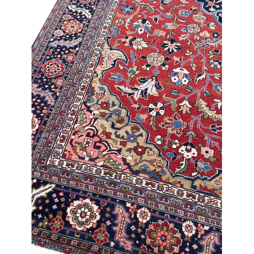 89 - ANTIQUE PERSIAN HERIZ CARPET, 375cm x 290cm.