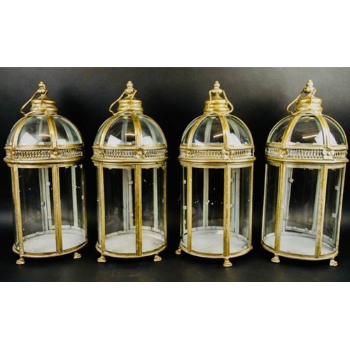 393 - STORM LANTERNS, a set of four, gilt metal, Regency style, 46cm H. (4)