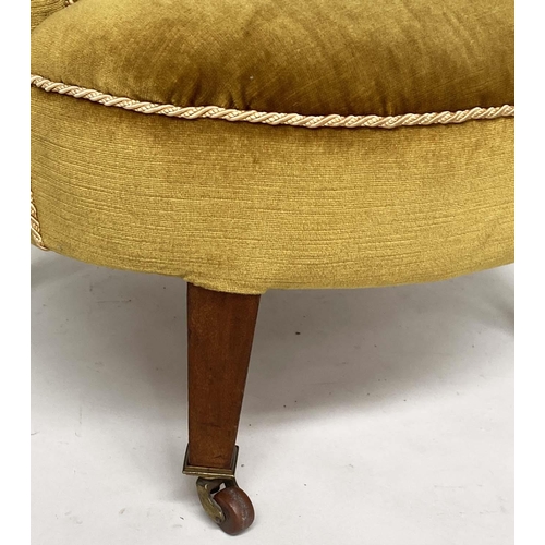 243 - ARMCHAIR, Edwardian mahogany with deep buttoned bow back, golden yellow velvet upholstered and taper... 