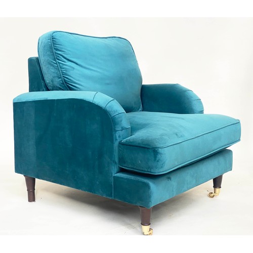 247 - ARMCHAIR, contemporary ocean blue velvet upholstery, with turned front supports and gilt metal casto... 