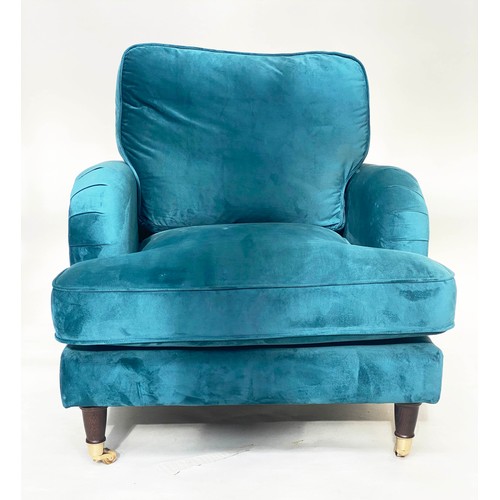 247 - ARMCHAIR, contemporary ocean blue velvet upholstery, with turned front supports and gilt metal casto... 