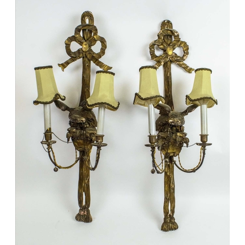 1 - WALL LIGHTS, a pair, 19th century carved giltwood with bow ribbon tops above eagles and twin branche... 