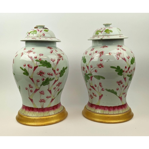 12 - CHINESE LIDDED TEMPLE VASES, a pair, inverted baluster form, hand painted in red and green foliage, ... 