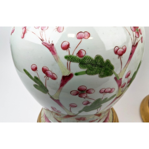 12 - CHINESE LIDDED TEMPLE VASES, a pair, inverted baluster form, hand painted in red and green foliage, ... 