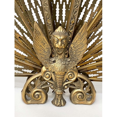 129 - 'FAN' FIREGUARD, 19th century style pierced brass foldout with winged griffin centre, 63cm H x 88cm ... 