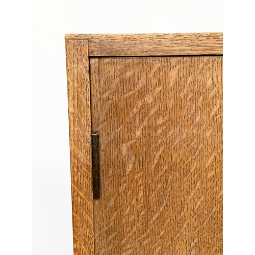 133 - WARDROBE, 1950s oak in the manner of Heals of London with two doors enclosing hanging space and shel... 