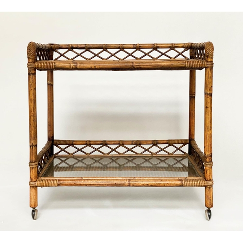 135 - CONSOLE TABLE, rattan framed and cane panelled with two glazed shelves, gallery and castors, 72cm x ... 