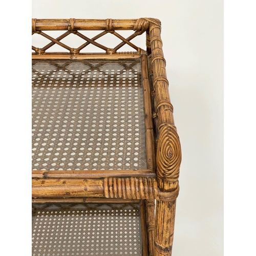 135 - CONSOLE TABLE, rattan framed and cane panelled with two glazed shelves, gallery and castors, 72cm x ... 