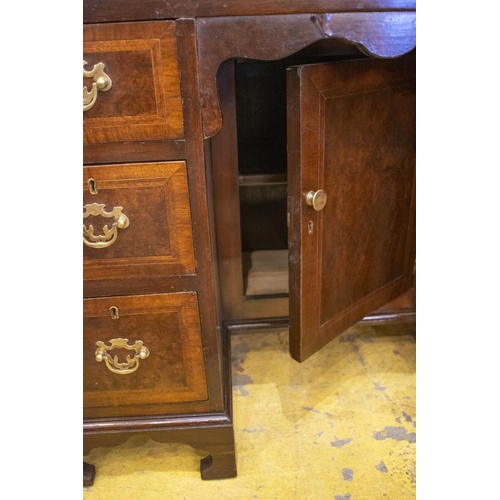 143 - KNEEHOLE DESK, 75cm H x 92cm x 56cm, early 20th century walnut and featherbanded with brown leather ... 