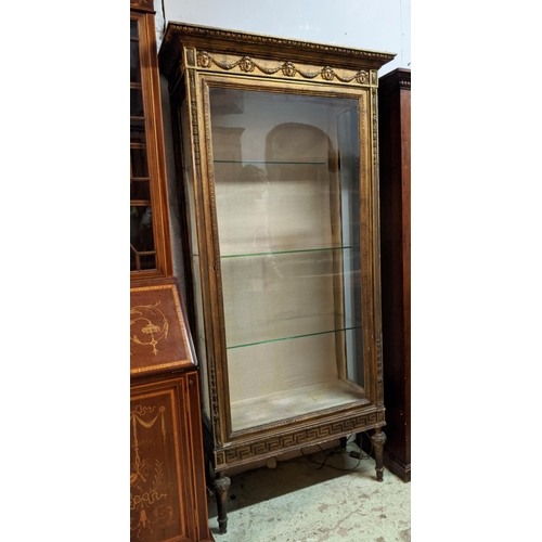 173 - VITRINE, 91cm x 191cm H x 43cm, 19th century giltwood with a decorative frieze and glazed door enclo... 