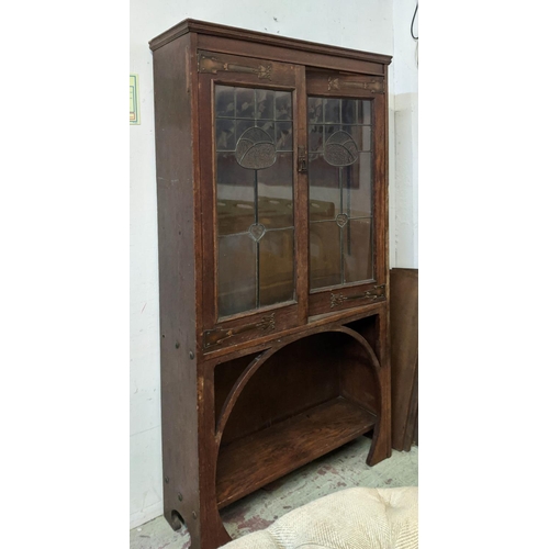 175 - ARTS AND CRAFTS BOOKCASE, early 20th century oak with leaded glazed doors, copper hinges and shelves... 