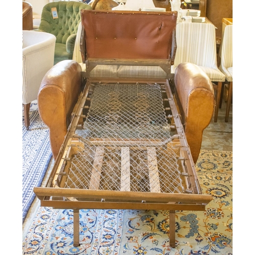 265 - ARMCHAIR BED, French Art Deco, brown leather, circa 1925, with retractable spring bed base, chair 78... 