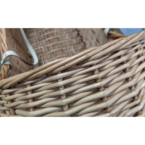 387 - WICKERWORK CRIB, 90cm x 38cm x 50cm, with two handles.