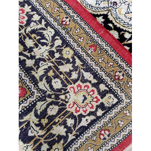 86 - FINE QUM SILK RUG, 210cm x 135cm.