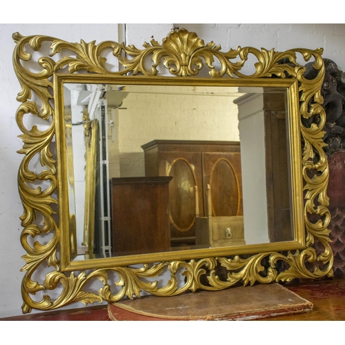 272 - WALL MIRROR, 101cm H x 123cm W, Florentine style giltwood with foliate scrolled frame.