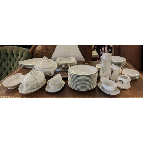 15 - PART DINNER SERVICE, Karlsbro Austria, including 14 plates and 7 soup bowls along with 2 lidded ture... 
